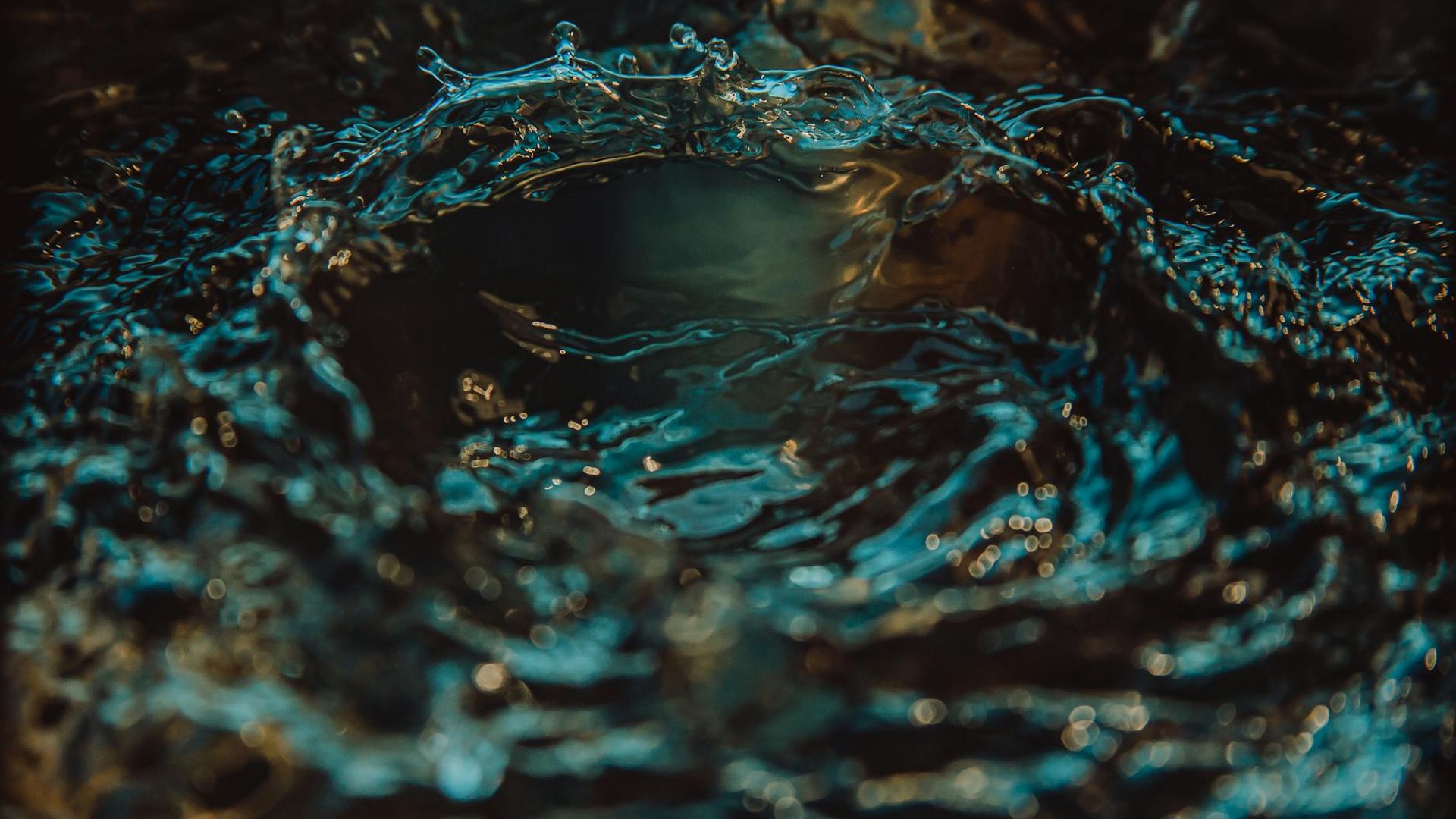 Serene background with abstract light trails suggesting fluid motion.